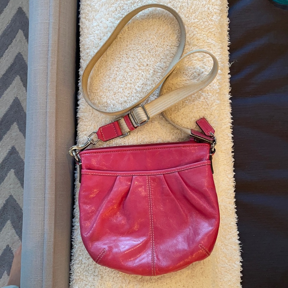 Coach pink pocketed cross body bag